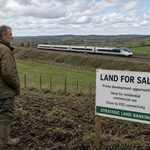 Man looking at his HS2 land - standing in the mud